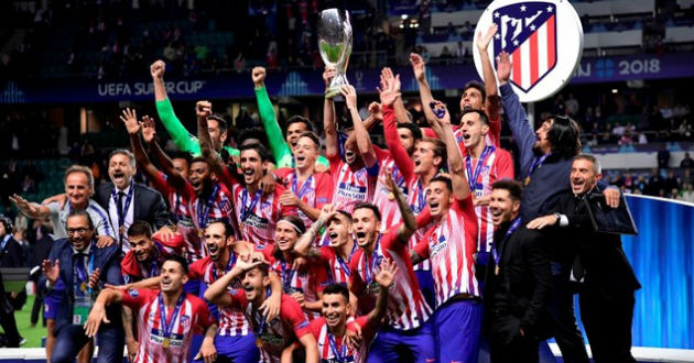 atletico madrid celebrate uefa super cup trophy