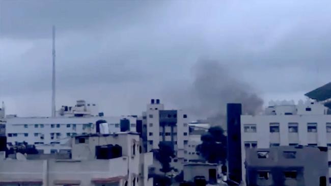 smoke is seen billowing in the vicinity of the al shifa hospital complex in gaza