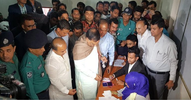 home minister at poll center