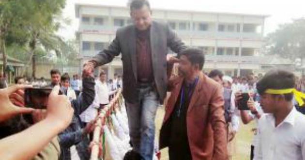 land donor walks on shoulder of students