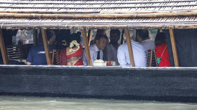 macron in boat