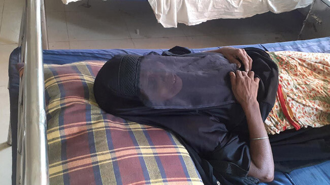 old woman get two dozes vacc