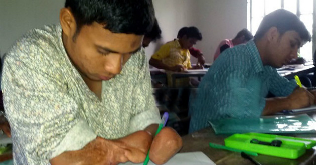 shah alam writes by his wrist