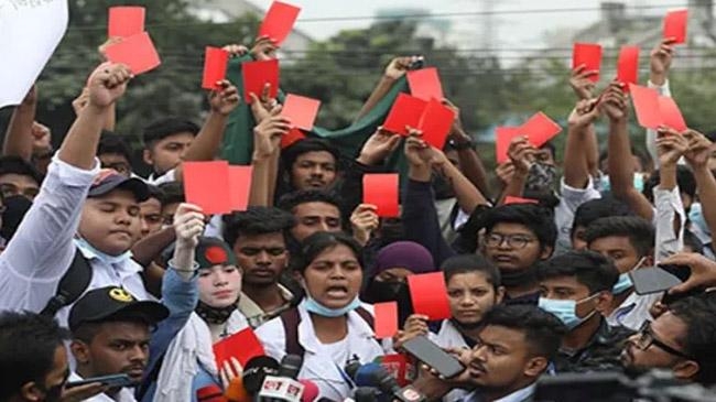 students showing red card road
