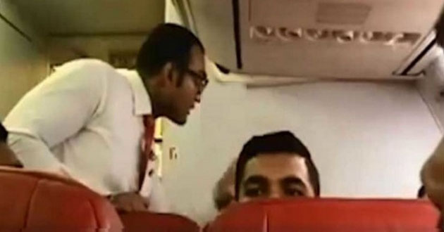 try to open the emergency gate of the aircraft to spit