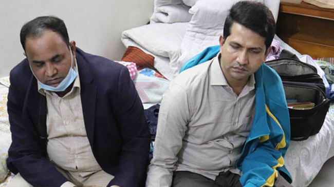 two auditors arrested