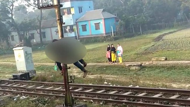 young man hanging in a pole