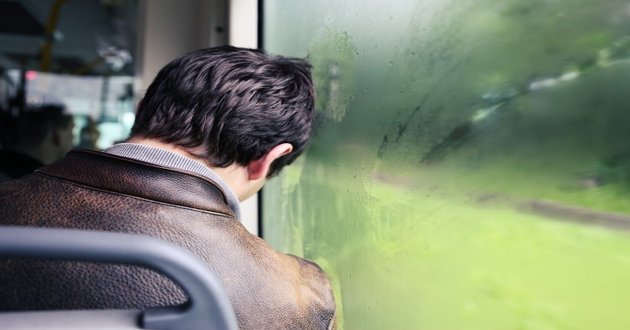 man sleeping on bus