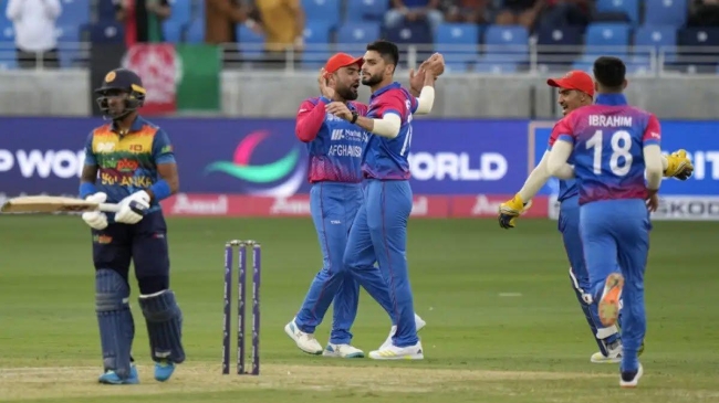 afghanistan players celebrate the fall of a sri lanka batter