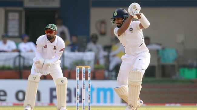 cheteshwar pujara drives through the covers