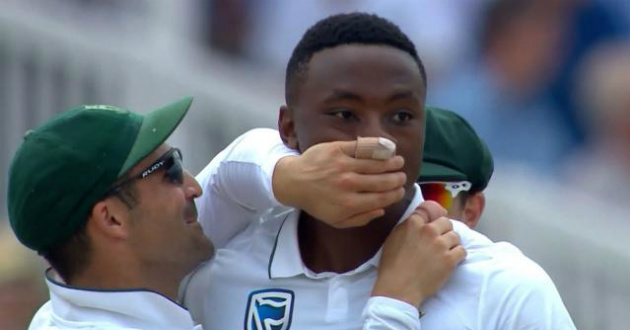 dean elgar put hand on face of rabada