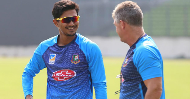 fazle rabbi talking to coach during practice session ahead of zimabwe series