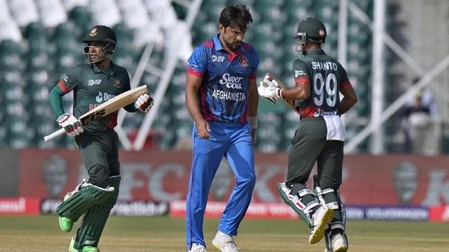 gulbadin naib walks back to his mark against bangladesh