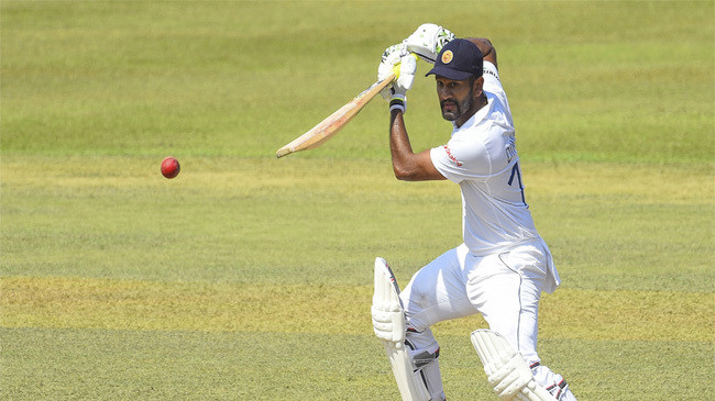 hundred for karunaratne