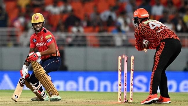 jaydev unadkat is congratulated by pat cummins for doing the job in the final over