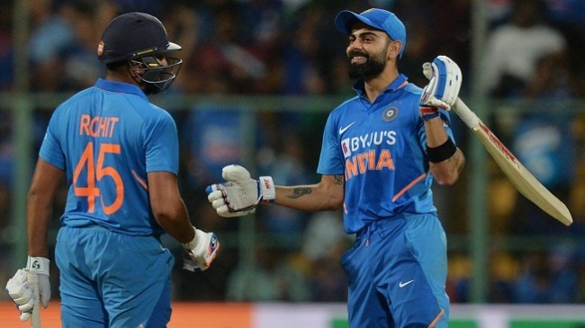 kohli congratulates rohit with a broad grin