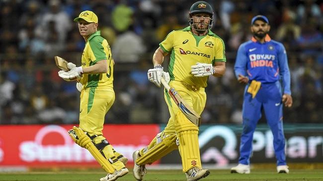 kohli looks on as finch and warner pile on the runs