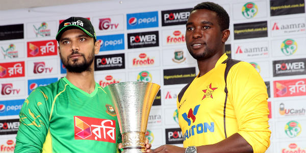 mashrafe and chigumbura holding trophy before the series begans