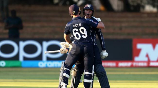 michael leask is hugged by chris sole