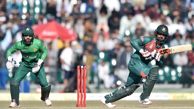 mohammad rizwan looks on as tamim iqbal