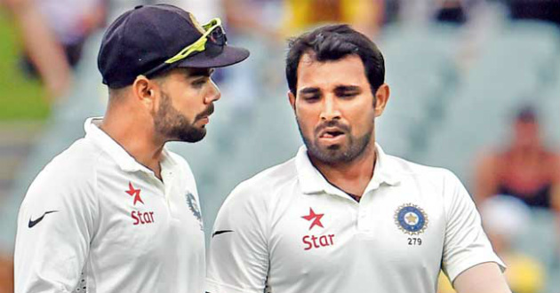 mohammad shami with his captain virat kohli