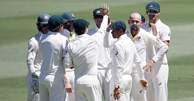 nathan lyon looks on after