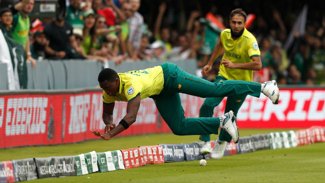 ngidi and tahir attempt to stop a boundary
