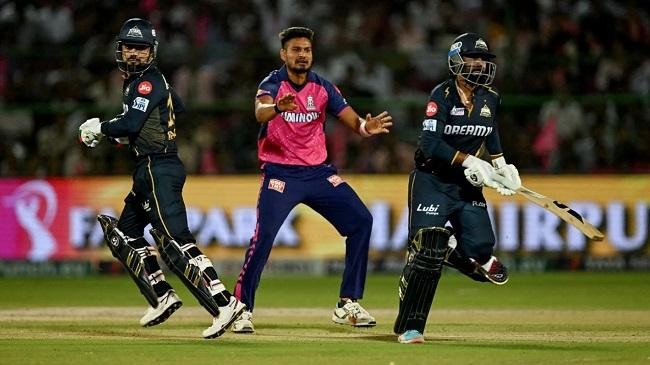 rashid khan and rahul tewatia run between the wickets as kuldeep sen reacts