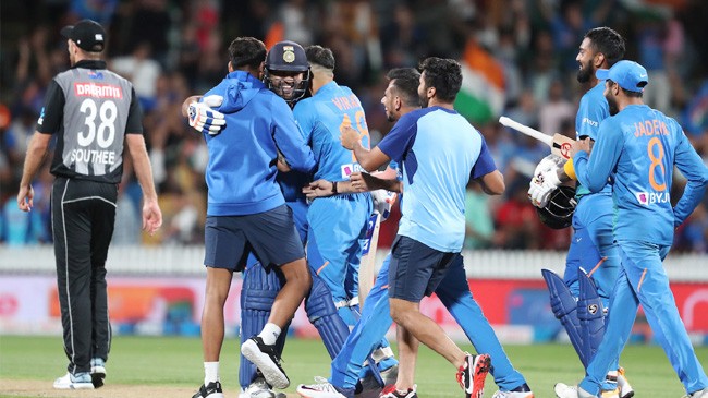 rohit sharma is mobbed after clinching the win