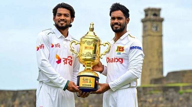 shanto and de silva pose with the series trophy