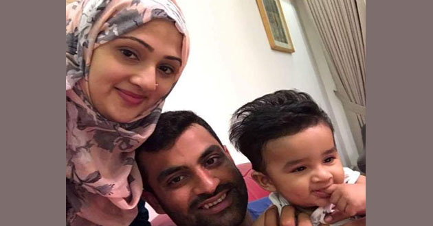tamim with his wife and son