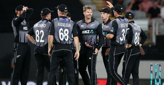the new zealand players celebrate a wicket 1