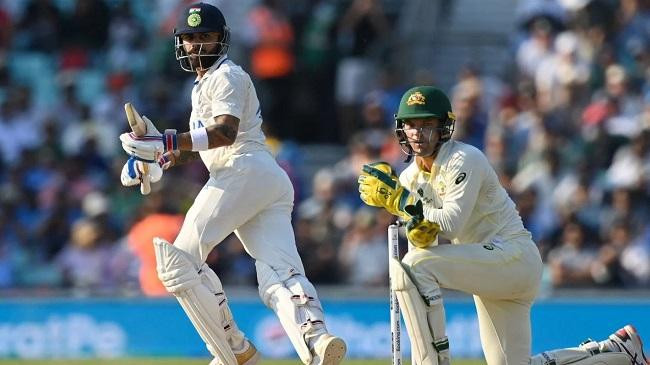 virat kohli and alex carey watch the ball roll fine