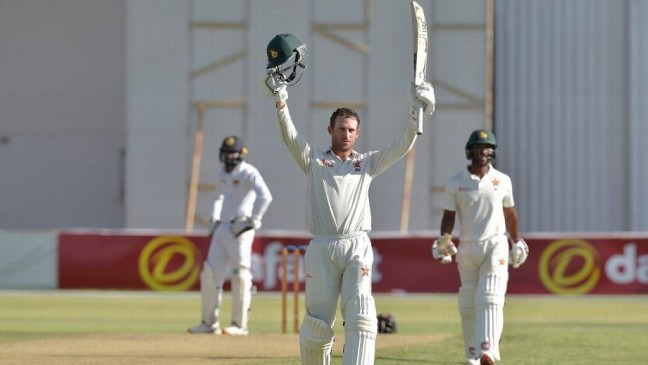 wlliams acknowledges the applause after reaching his century