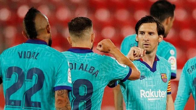 lionel messi celebrating a goal with teammates