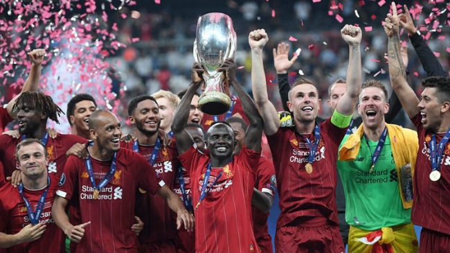 liverpool celebrating uefa super cup trophy