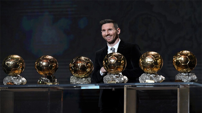 messi with ballon d or