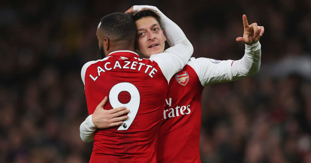 ozil and lacazette celebrate their goal