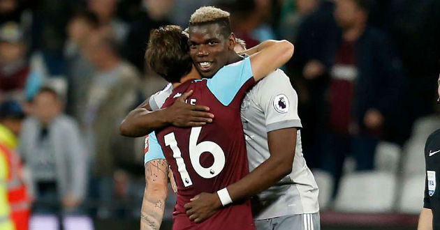 pogba and noble share a hug