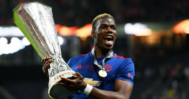 pogba celebrates with a trophy