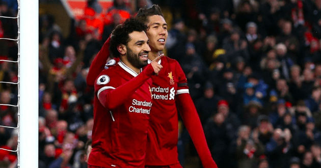 salah celebrates a goal with firmino