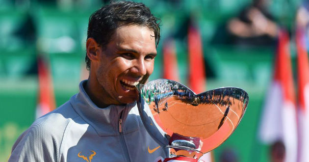 nadal celebrates his championship with trophy