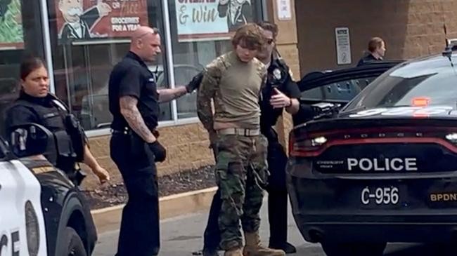 a man is detained following a mass shooting
