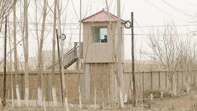 a security person watches from a guard tower