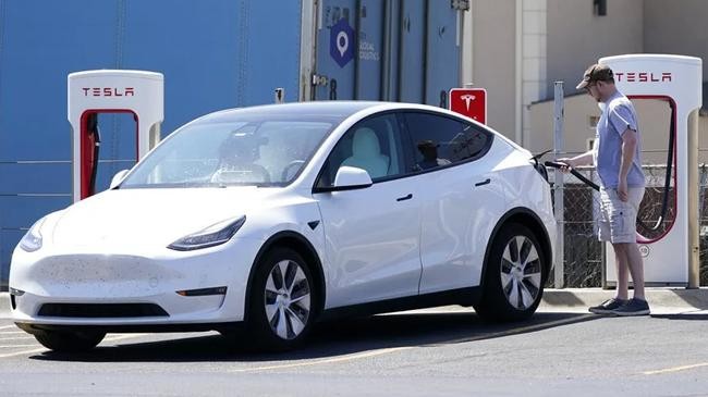 a tesla owner charges his vehicle