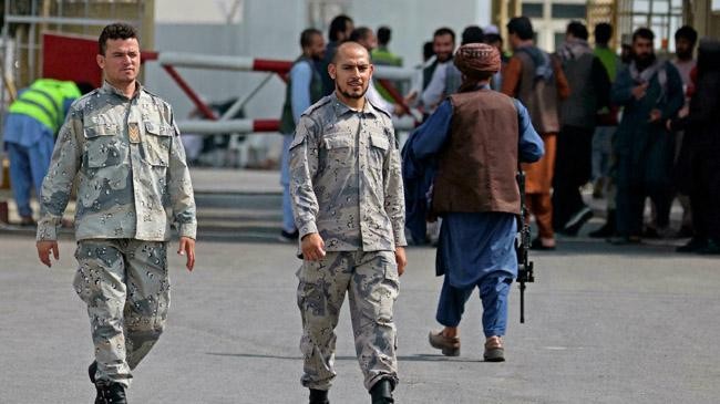 afghan police join work under taliban