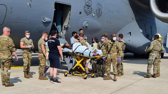 afghan woman gives birth plane