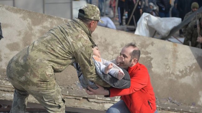 baby is rescued under the rubble