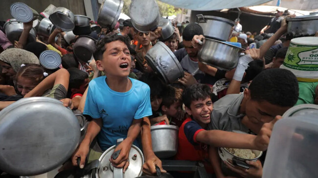 charity organizations distribute food to palestinians at nusierat refugee camp