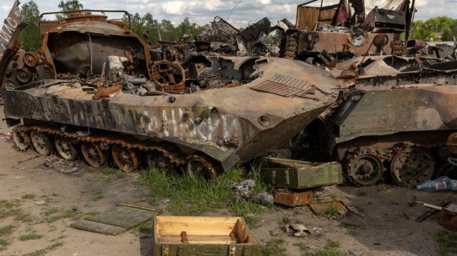 destroyed russian tanks and military vehicles are seen dumped in bucha